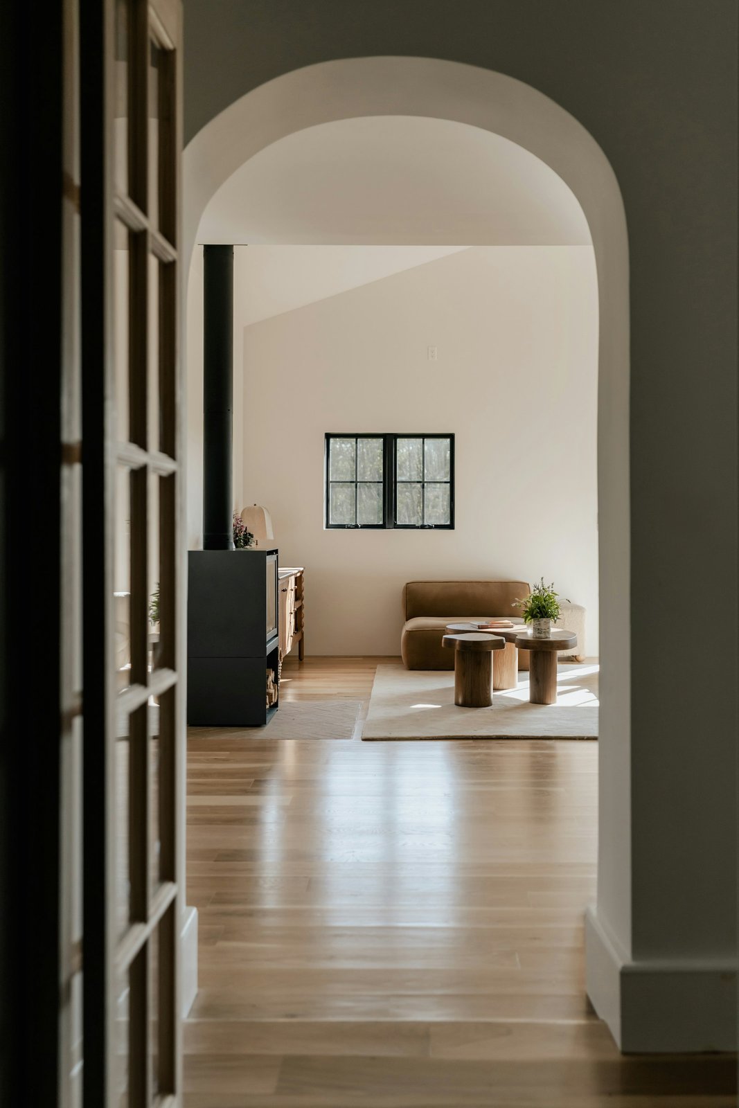 Freshly installed wood flooring running down a home hallway